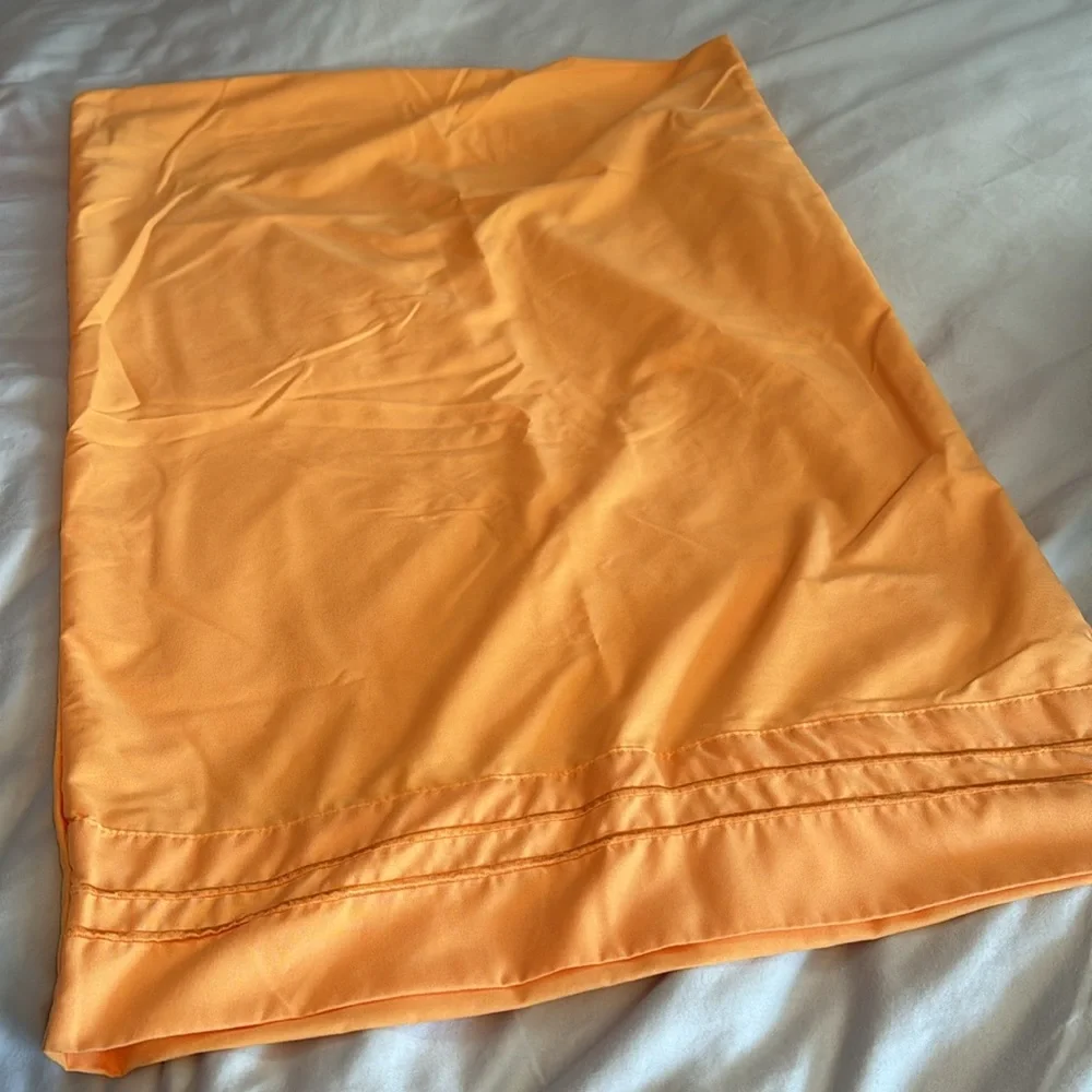Pair of microfiber pillowcases in tangerine. EUC.